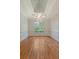 Spacious dining room with tray ceilings, hardwood floors and decorative wainscoting at 1208 Wynnwood Ct, Mount Pleasant, SC 29466