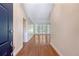 View from the front door, showcasing hardwood floors and a bright, open living space at 1208 Wynnwood Ct, Mount Pleasant, SC 29466