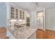 Kitchen featuring a large island with granite countertops, stainless steel sink, and white cabinets at 1208 Wynnwood Ct, Mount Pleasant, SC 29466