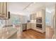 Spacious kitchen featuring wood floors, granite counters, stainless steel appliances and an island at 1208 Wynnwood Ct, Mount Pleasant, SC 29466
