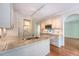 Kitchen featuring granite countertops, stainless steel appliances, white cabinets, and wood floors at 1208 Wynnwood Ct, Mount Pleasant, SC 29466