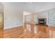 Spacious living room with hardwood floors, fireplace, large windows with plantation shutters at 1208 Wynnwood Ct, Mount Pleasant, SC 29466