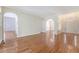 Open-concept living area with hardwood floors and archways leading to other rooms at 1208 Wynnwood Ct, Mount Pleasant, SC 29466
