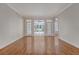 Spacious living room with hardwood floors, white walls, and glass doors leading to the backyard at 1208 Wynnwood Ct, Mount Pleasant, SC 29466
