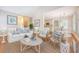 Bright and tastefully decorated living room adjacent to dining area and staircase at 1208 Wynnwood Ct, Mount Pleasant, SC 29466