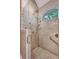Updated shower with glass door, mosaic tile accents, hand shower, rain shower and safety bar at 1208 Wynnwood Ct, Mount Pleasant, SC 29466