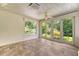 Bright sunroom featuring tile floors, white trim, and scenic views at 1208 Wynnwood Ct, Mount Pleasant, SC 29466