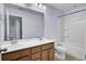 Bathroom featuring a double sink vanity with wood cabinets and a combined shower and tub at 123 Blackwater Way, Moncks Corner, SC 29461