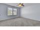 Well-lit bedroom features carpeted floors, pale blue walls, and a ceiling fan for optimal comfort at 123 Blackwater Way, Moncks Corner, SC 29461