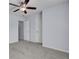 Bedroom with carpet, ceiling fan, two white doors, and light-blue walls at 123 Blackwater Way, Moncks Corner, SC 29461