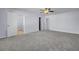 Large carpeted bedroom boasting ceiling fan and multiple doorways offering easy access to other rooms at 123 Blackwater Way, Moncks Corner, SC 29461