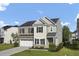 Charming home featuring a brick and siding exterior, an attached garage, and a nicely landscaped front yard at 123 Blackwater Way, Moncks Corner, SC 29461
