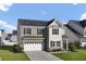 Attractive two-story home with brick and siding, featuring a two-car garage and an inviting front lawn at 123 Blackwater Way, Moncks Corner, SC 29461