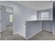 Well-lit hallway with neutral paint and soft carpeting, with entrances to other rooms at 123 Blackwater Way, Moncks Corner, SC 29461