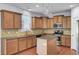 Well-equipped kitchen with granite countertops, island, and stainless steel appliances at 123 Blackwater Way, Moncks Corner, SC 29461