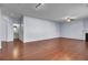 Spacious living room with hardwood floors, neutral walls, and a view to the bathroom at 123 Blackwater Way, Moncks Corner, SC 29461