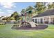 Community playground with slides and climbing structures on green grass at 123 Blackwater Way, Moncks Corner, SC 29461