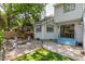 Charming backyard features a fire pit, Adirondack chairs, string lights and lush landscaping at 1274 Hampshire Rd, Charleston, SC 29412