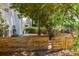 Private backyard with a modern fence and mature trees at 1274 Hampshire Rd, Charleston, SC 29412