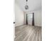 Bright bedroom features hardwood floors, a large window, and modern light fixture at 1274 Hampshire Rd, Charleston, SC 29412