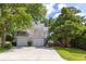 Traditional two-story home with a two-car garage, long driveway, and beautifully landscaped front yard at 1274 Hampshire Rd, Charleston, SC 29412