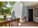 Inviting front entrance with a wood porch and stairway leading up to the front door with views of the lawn at 1274 Hampshire Rd, Charleston, SC 29412