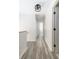 Hallway featuring hardwood floors, white trim, and neutral walls at 1274 Hampshire Rd, Charleston, SC 29412