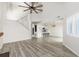 Bright, airy living room with vaulted ceilings, wood floors, and open layout leading to the kitchen at 1274 Hampshire Rd, Charleston, SC 29412