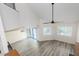Bright, open living area features a high ceiling, lots of natural light, and vinyl plank flooring at 1274 Hampshire Rd, Charleston, SC 29412