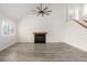 Spacious living room with wood floors, fireplace, and vaulted ceilings creating a bright and airy ambiance at 1274 Hampshire Rd, Charleston, SC 29412