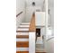 View of the wood stairs featuring white risers and a wood handrail at 1274 Hampshire Rd, Charleston, SC 29412