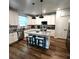 Bright kitchen featuring a center island with seating and stainless steel appliances at 136 Caleb Ct, Ladson, SC 29456
