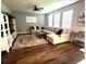 Cozy living room with a plush sectional sofa, decorative rug, and ample natural light at 136 Caleb Ct, Ladson, SC 29456