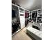 Well-organized walk-in closet with custom shelving, hanging racks, and ottoman seating at 136 Caleb Ct, Ladson, SC 29456