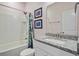 Charming bathroom with bathtub and shower combination and white vanity with granite countertop at 136 Rowans Creek Dr, Charleston, SC 29492