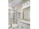 Bright bathroom featuring a glass enclosed shower, granite countertop, and decorative shelving at 136 Rowans Creek Dr, Charleston, SC 29492
