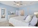 Cozy bedroom featuring a queen bed, light blue walls, and modern furnishings at 136 Rowans Creek Dr, Charleston, SC 29492