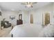 Spacious bedroom with a ceiling fan, ensuite bathroom, and comfortable seating area at 136 Rowans Creek Dr, Charleston, SC 29492