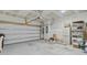 Clean garage with a white door, neutral walls, and concrete floors provides secure parking at 136 Rowans Creek Dr, Charleston, SC 29492