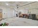 Spacious garage with neutral painted walls and overhead lighting perfect for parking and storage at 136 Rowans Creek Dr, Charleston, SC 29492