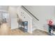 Hallway with wood floors, staircase, and stylish console table at 136 Rowans Creek Dr, Charleston, SC 29492