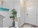 Hallway with hooks, storage cabinet, and decor accents at 136 Rowans Creek Dr, Charleston, SC 29492