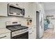 The modern kitchen features stainless appliances and stone countertops, and open floor plan at 136 Rowans Creek Dr, Charleston, SC 29492