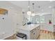 The modern kitchen island features beautiful countertops, storage and hardwood floors at 136 Rowans Creek Dr, Charleston, SC 29492