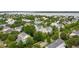 Aerial view of neighborhood highlighting house, lush greenery, and river views at 1407 Wando View St, Daniel Island, SC 29492