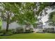 Expansive backyard featuring lush landscaping, a patio, and an inviting outdoor space at 1407 Wando View St, Daniel Island, SC 29492