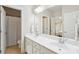 Bathroom features double sinks, white cabinetry, and a large mirror at 1407 Wando View St, Daniel Island, SC 29492