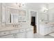 Bathroom featuring double sinks, bright white cabinets, and a large mirror at 1407 Wando View St, Daniel Island, SC 29492
