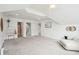 Spacious bonus room with recessed lighting and a comfortable chair at 1407 Wando View St, Daniel Island, SC 29492