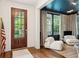 Welcoming entryway featuring hardwood floors and a glimpse into the stylish living room at 1407 Wando View St, Daniel Island, SC 29492